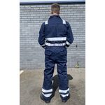 engineer wearing blue flame retardant coveralls